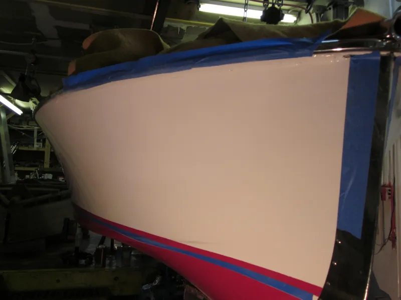 Slide: The Image of 1948 Chris-Craft Racer boat under restoration in a workshop setting. - 19