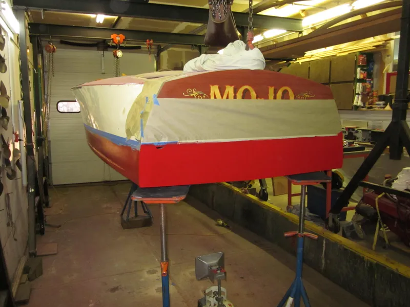 Slide: The Image of 1948 Chris-Craft Racer boat undergoing restoration in a workshop. - 20
