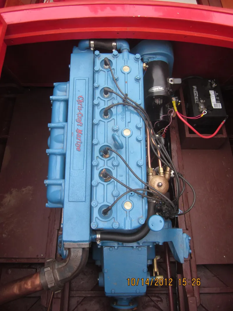 Slide: The Image of 1948 Chris-Craft Racer engine, blue, detailed view with wiring and components. - 23
