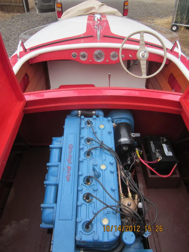 Slide: The Image of 1948 Chris-Craft Racer boat interior with blue engine and red dashboard. - 24