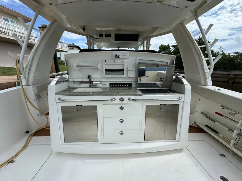 Slide: The Image of 2020 Boston Whaler 420 Outrage boat interior with sleek kitchen setup. - 16