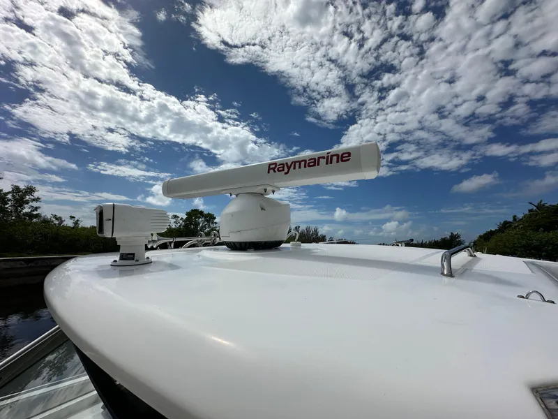 Slide: The Image of Boston Whaler 420 Outrage 2020 with Raymarine radar under a partly cloudy sky. - 22