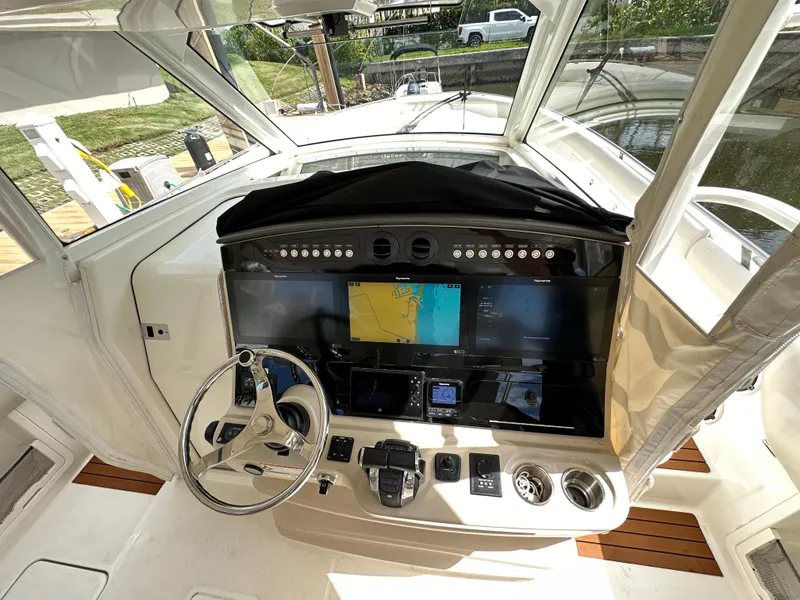 Slide: The Image of 2020 Boston Whaler 420 Outrage helm with advanced navigation system and controls. - 25
