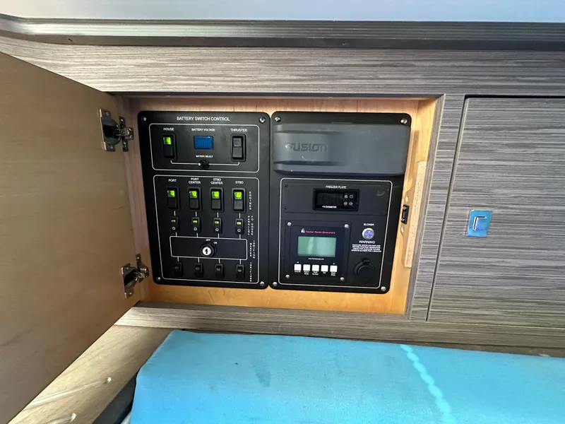 Slide: The Image of Control panel inside 2020 Boston Whaler 420 Outrage boat cabin. - 27