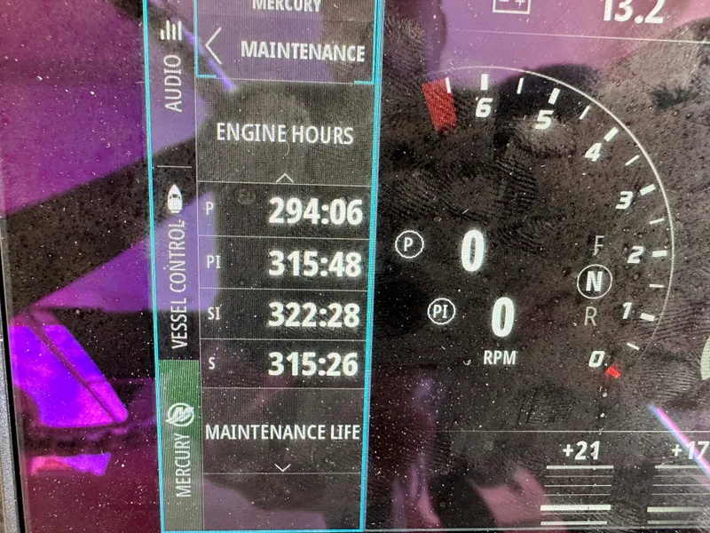 Slide: The Image of Dashboard display of 2020 Boston Whaler 420 Outrage showing engine hours and maintenance data. - 30