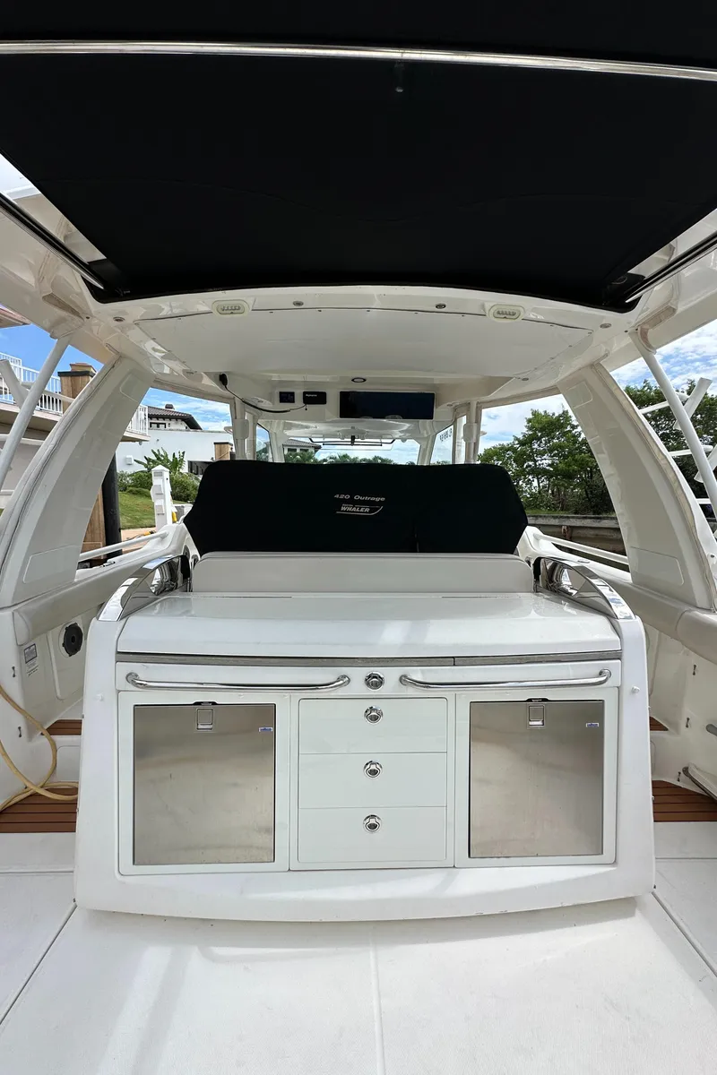 Slide: The Image of 2020 Boston Whaler 420 Outrage interior with sleek cabinetry and modern design. - 38