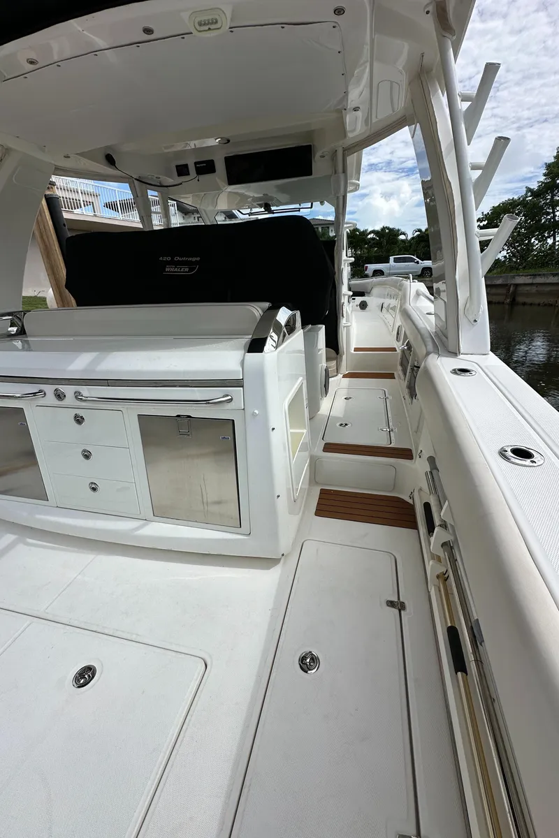 Slide: The Image of 2020 Boston Whaler 420 Outrage boat interior with sleek design and modern amenities. - 39