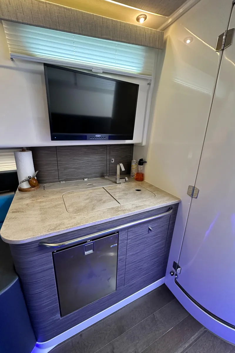 Slide: The Image of 2020 Boston Whaler 420 Outrage interior kitchen with modern appliances and sleek design. - 42