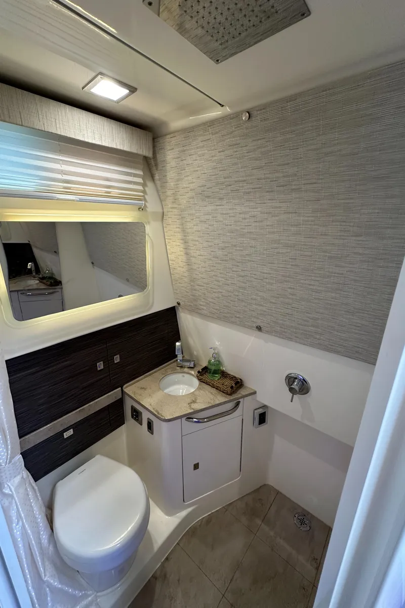 Slide: The Image of 2020 Boston Whaler 420 Outrage bathroom with modern fixtures and sleek design. - 43