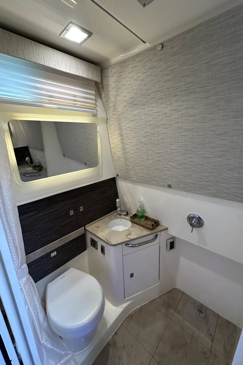 Slide: The Image of 2020 Boston Whaler 420 Outrage bathroom with modern fixtures and sleek design. - 44