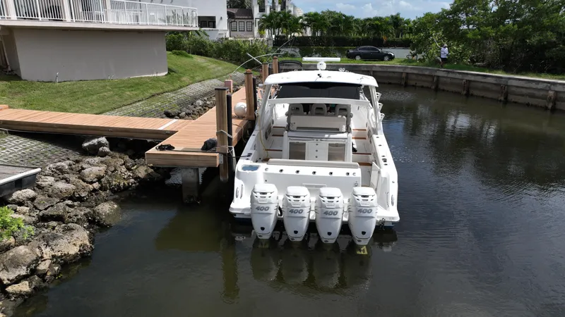 Slide: The Image of Boston Whaler 420 Outrage 2020 docked with four powerful outboard engines. - 7