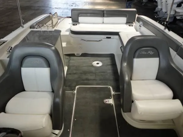 Slide: The Image of 2011 Sea Ray 280 Sundeck interior with gray and white seating. - 14