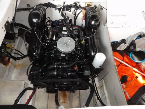 Slide: The Image of Engine compartment of 2011 Sea Ray 280 Sundeck with visible life jackets. - 18