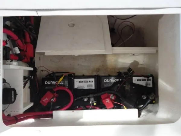 Slide: The Image of Battery compartment of 2011 Sea Ray 280 Sundeck with Duracell batteries and wiring. - 19