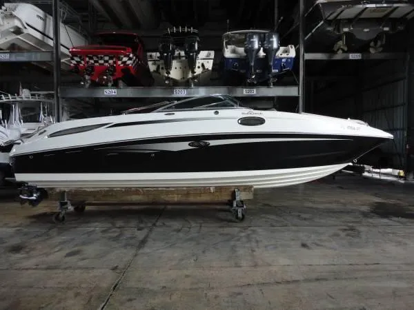 Slide: The Image of 2011 Sea Ray 280 Sundeck boat in indoor storage facility. - 2