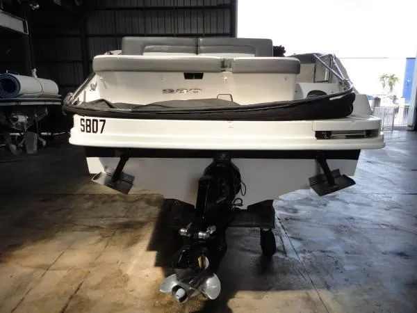 Slide: The Image of 2011 Sea Ray 280 Sundeck boat in storage, rear view. - 4