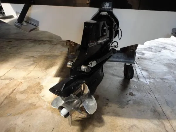 Slide: The Image of 2011 Sea Ray 280 Sundeck boat propeller and stern drive in a garage. - 6