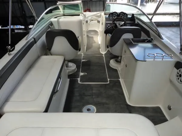 Slide: The Image of 2011 Sea Ray 280 Sundeck interior with seating and helm, showcasing luxury design. - 7