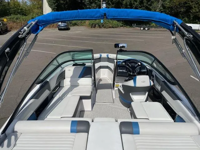 Slide: The Image of 2016 Regal 2100 RX Surf boat interior with blue accents and seating. - 3
