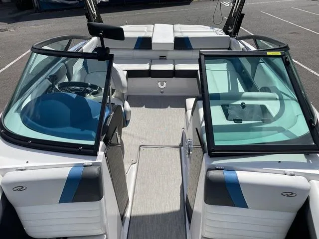 Slide: The Image of 2016 Regal 2100 RX Surf boat interior with seating and windshield. - 4