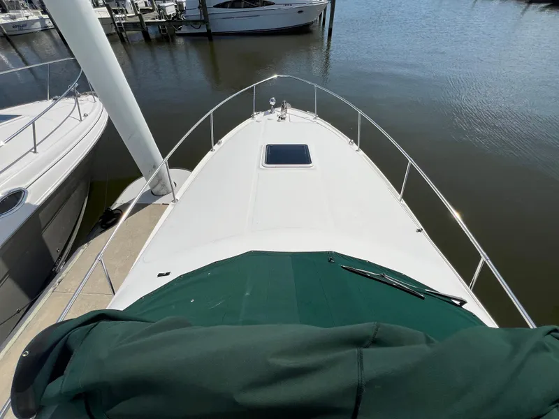 Slide: The Image of 2001 Sea Ray 270 Sundancer docked at marina, view from bow. - 18
