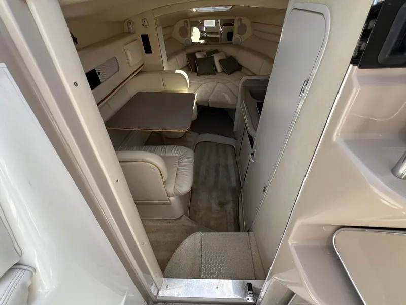Slide: The Image of Interior of 2001 Sea Ray 270 Sundancer, featuring seating and table area. - 19