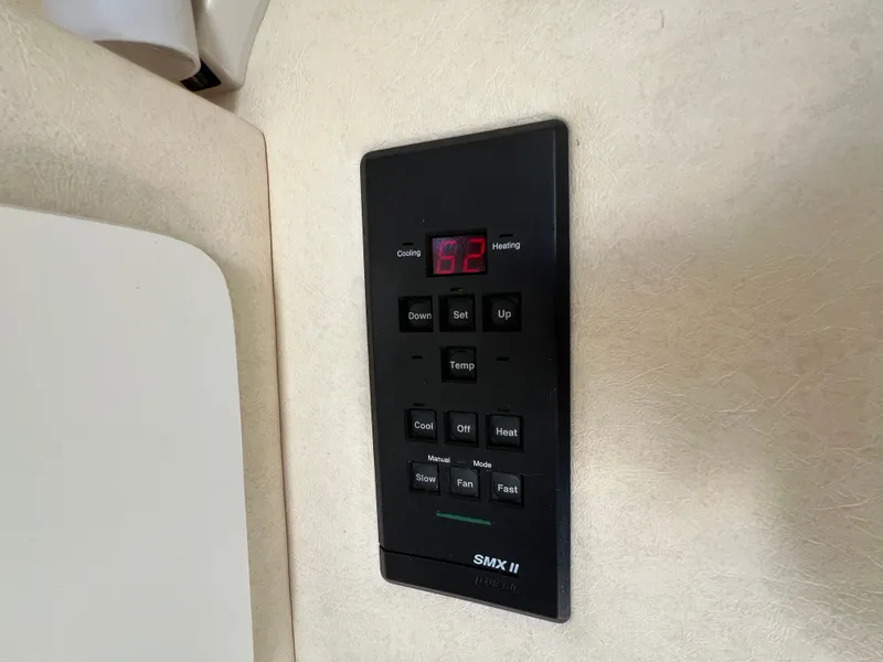 Slide: The Image of Thermostat control panel on 2001 Sea Ray 270 Sundancer boat interior. - 25