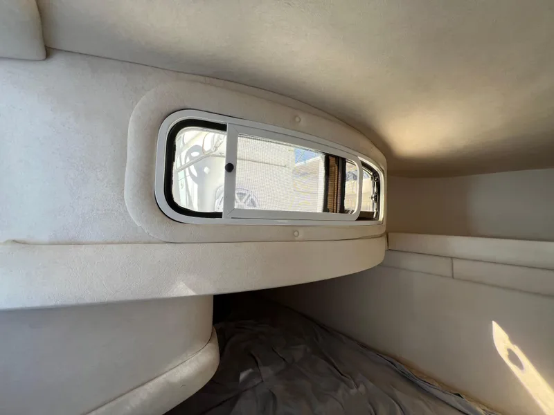 Slide: The Image of Interior cabin of 2001 Sea Ray 270 Sundancer with window view. - 29