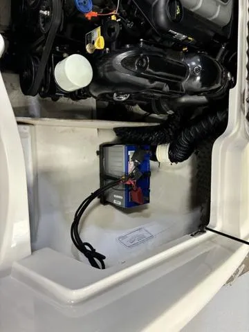 Slide: The Image of 2013 Tahoe Q5i SF boat engine compartment with battery and wiring. - 13