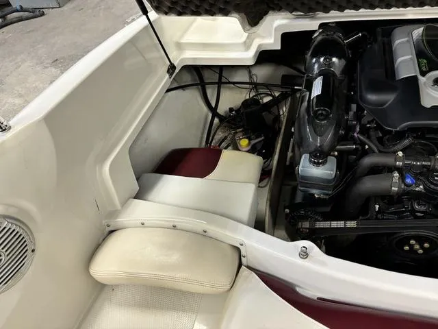 Slide: The Image of 2013 Tahoe Q5i SF boat engine compartment with seating area. - 14