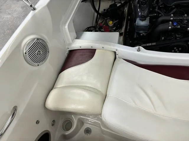 Slide: The Image of 2013 Tahoe Q5i SF boat interior with white and maroon seating, speaker, and engine compartment. - 15