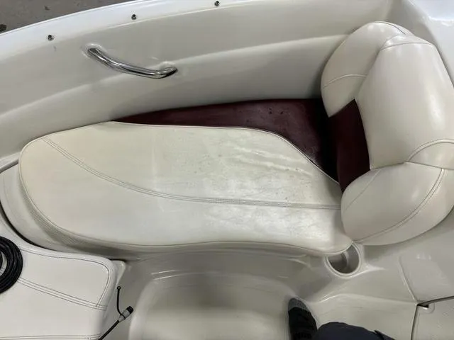 Slide: The Image of 2013 Tahoe Q5i SF boat interior with white and maroon seating. - 18