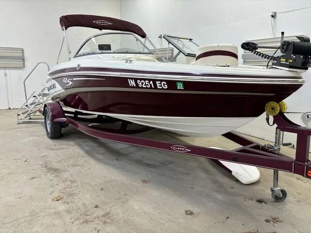 Slide: The Image of 2013 Tahoe Q5i SF boat on trailer in indoor storage. - 22