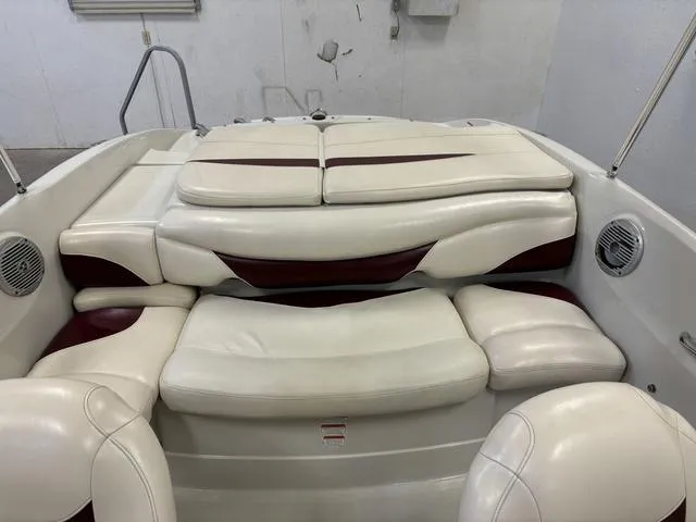 Slide: The Image of 2013 Tahoe Q5i SF boat interior with white and maroon seating. - 3