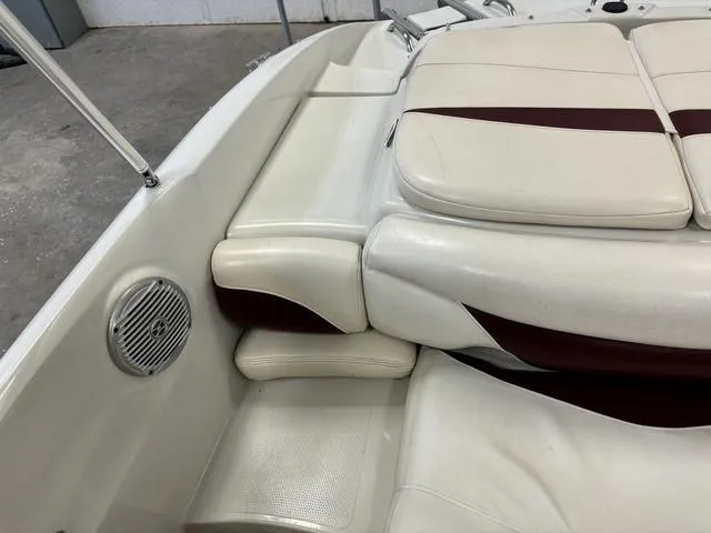 Slide: The Image of 2013 Tahoe Q5i SF boat interior with white and maroon seating. - 4