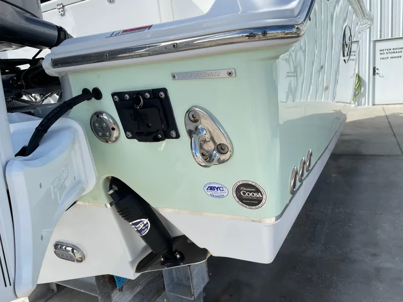 Slide: The Image of 2022 Sea Hunt Gamefish 25 boat stern with Coosa and ABYC certification badges. - 14
