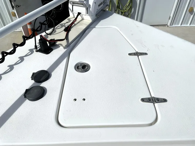 Slide: The Image of 2022 Sea Hunt Gamefish 25 boat deck with hatch and trolling motor. - 27