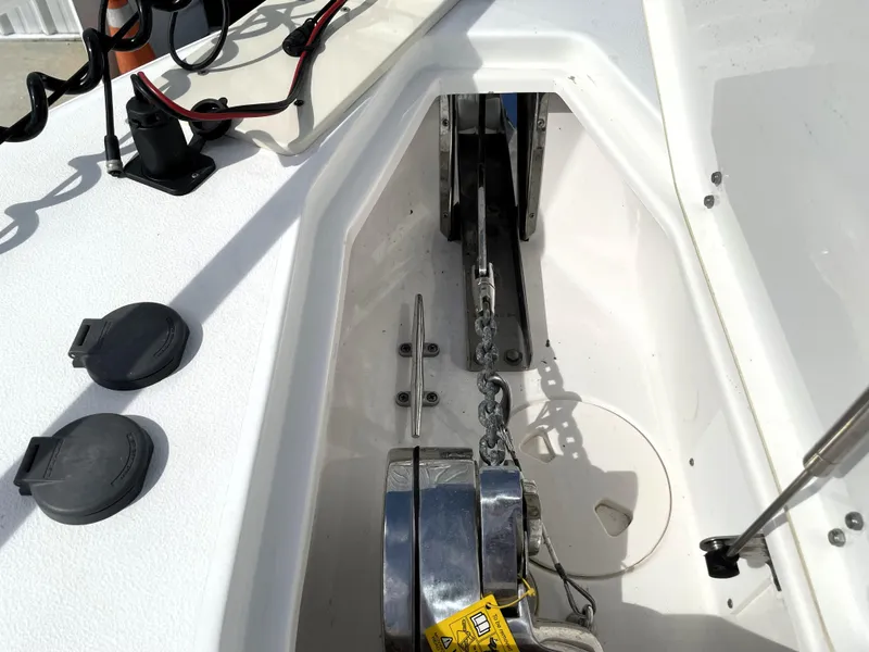 Slide: The Image of 2022 Sea Hunt Gamefish 25 anchor locker with chain and winch system. - 28