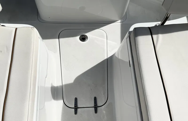 Slide: The Image of 2022 Sea Hunt Gamefish 25 boat interior with storage compartment and seating. - 29