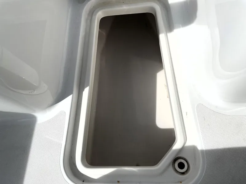 Slide: The Image of Open storage compartment on 2022 Sea Hunt Gamefish 25 boat. - 30