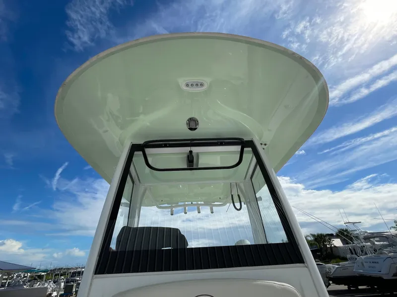 Slide: The Image of 2022 Sea Hunt Gamefish 25 boat, viewed from below against a clear blue sky. - 32