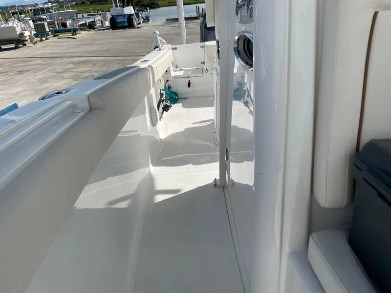 Slide: The Image of 2022 Sea Hunt Gamefish 25 boat deck, featuring sleek white design and spacious layout. - 33