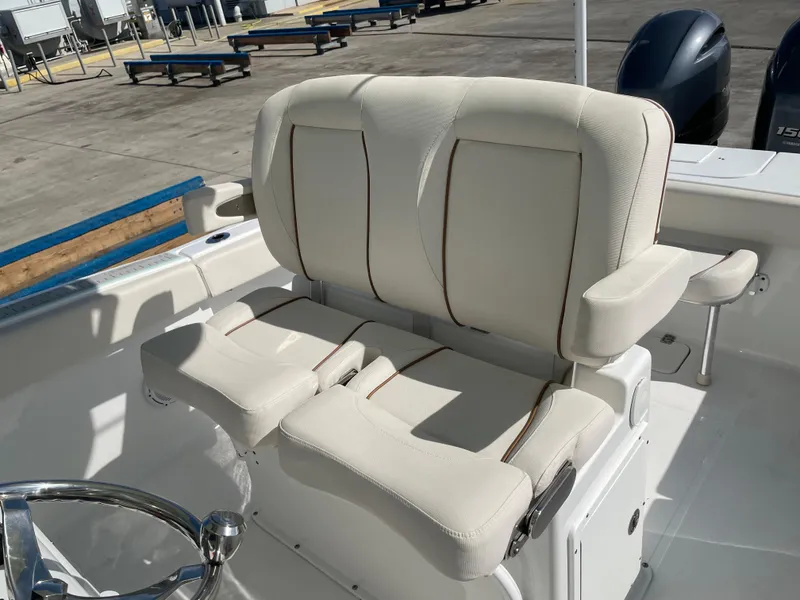 Slide: The Image of 2022 Sea Hunt Gamefish 25 boat seating with white upholstery and armrests. - 36