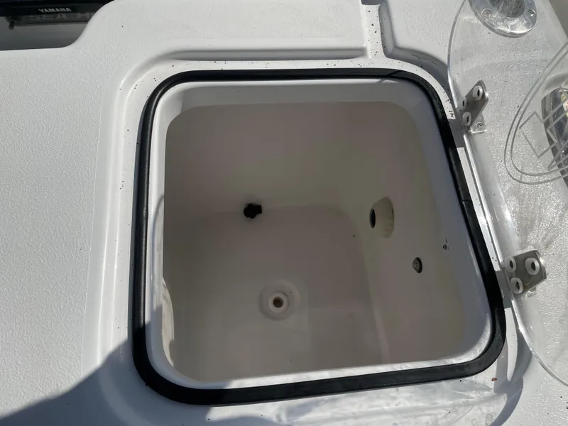 Slide: The Image of Open storage compartment on 2022 Sea Hunt Gamefish 25 boat. - 47
