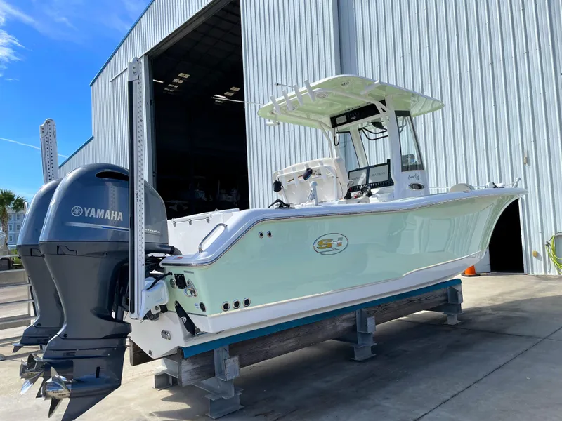 Slide: The Image of 2022 Sea Hunt Gamefish 25 boat with Yamaha engine in marina. - 5