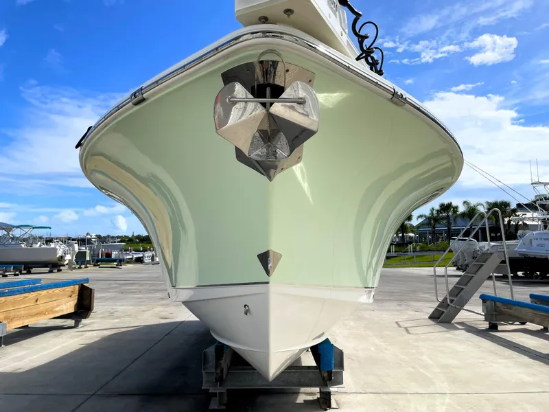 Slide: The Image of 2022 Sea Hunt Gamefish 25 boat on display at a marina. - 7