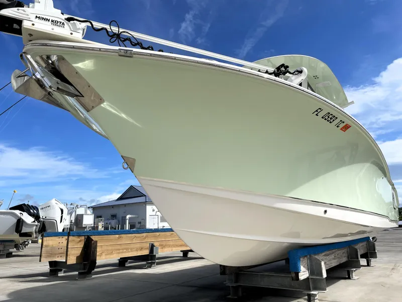 Slide: The Image of 2022 Sea Hunt Gamefish 25 boat on display under a clear blue sky. - 9