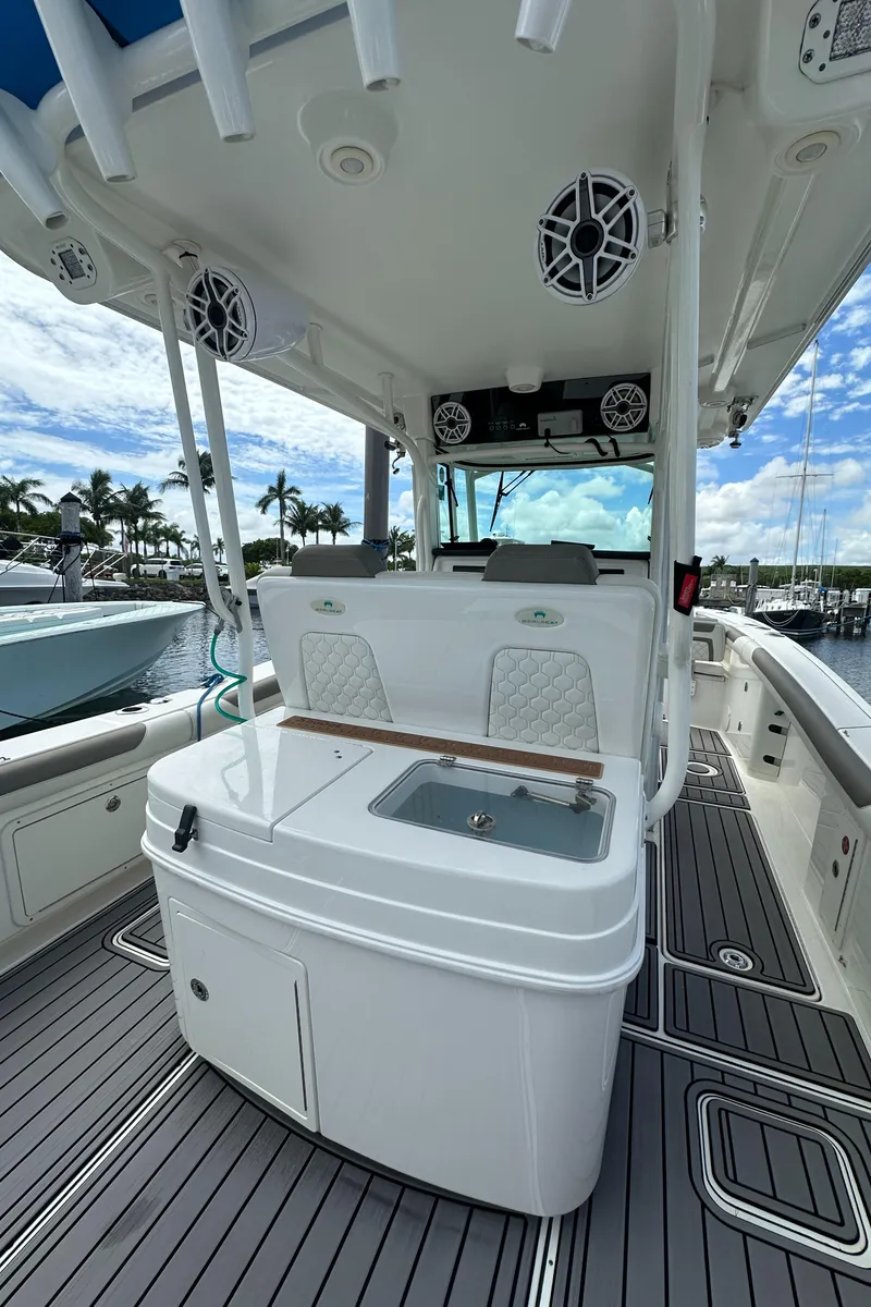 Slide: The Image of 2020 World Cat 325 CC boat interior with fishing station and speakers. - 17