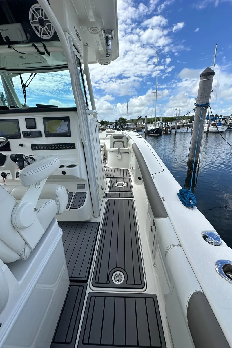 Slide: The Image of 2020 World Cat 325 CC boat interior, featuring sleek design and advanced navigation equipment. - 18