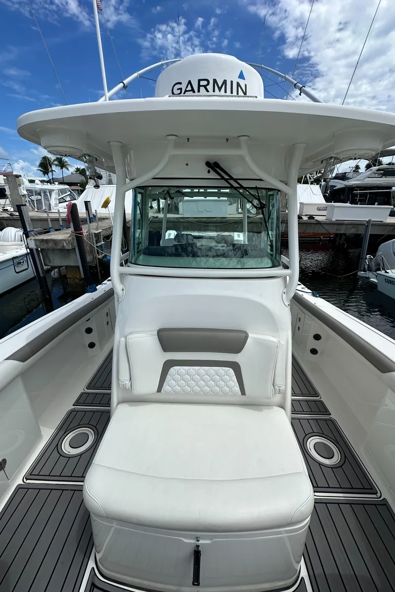 Slide: The Image of 2020 World Cat 325 CC boat with Garmin equipment, docked at marina. - 19